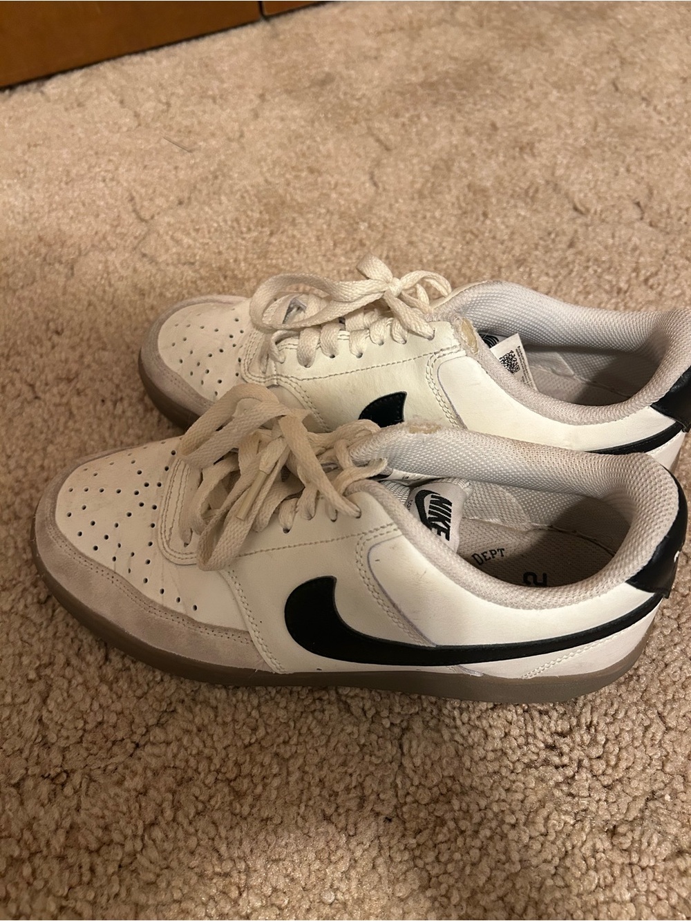 Nike White Low-Top Sneakers with Black Heel Detail